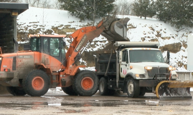 A Cole County Public Works truck refills on pretreatment materials during Wednesday's winter storm