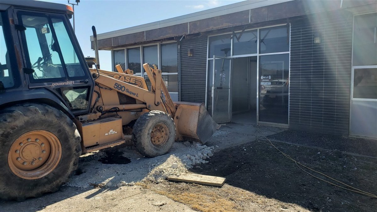An excavator parked just outside the Jefferson City Memorial Airport terminal on March 3, 2020.