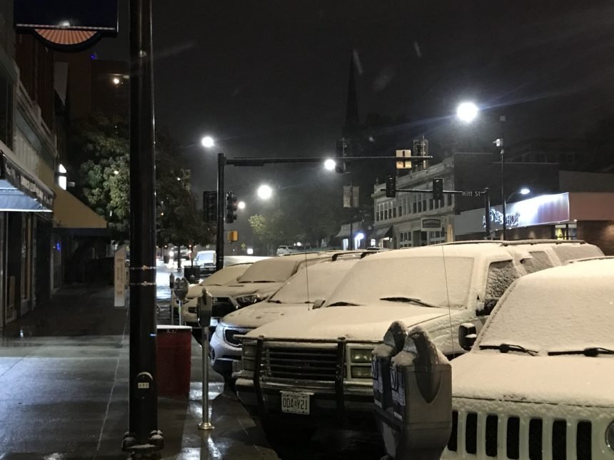 Snow on cars in downtown Columbia