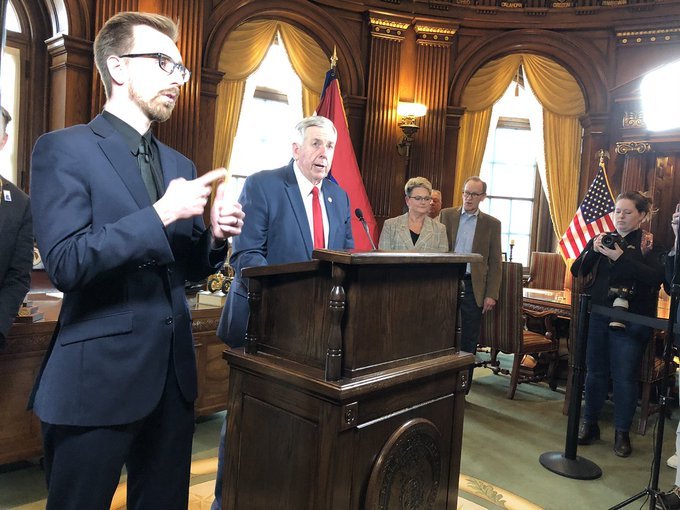 Gov. Mike Parson, center, announcing his emergency declaration in response to the COVID-19 pandemic Friday, March 13, 2020.