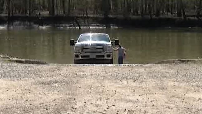 A Boone County deputy at PErche Creek April 7 after the body of a man was found.