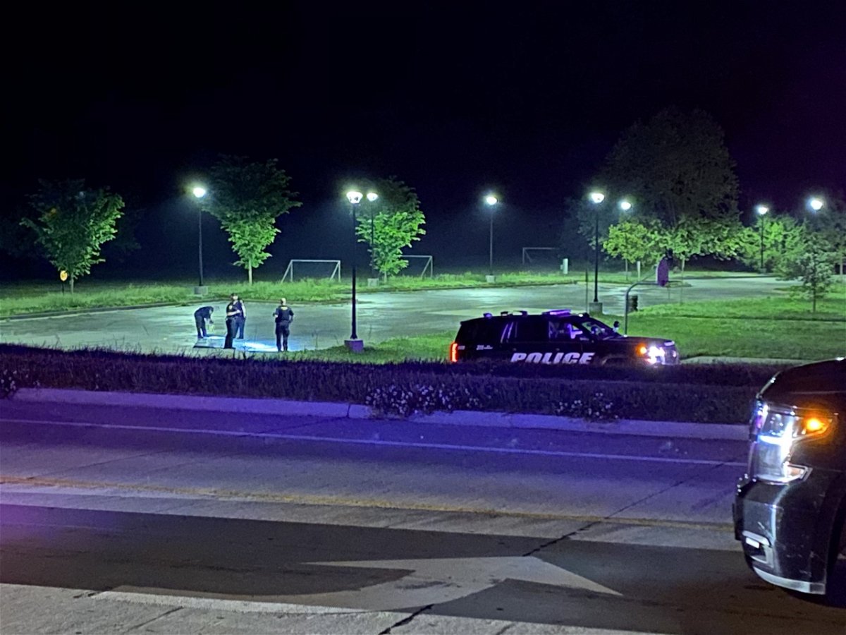 Police investigate a shooting in Jay Dix Station parking lot on Friday night.