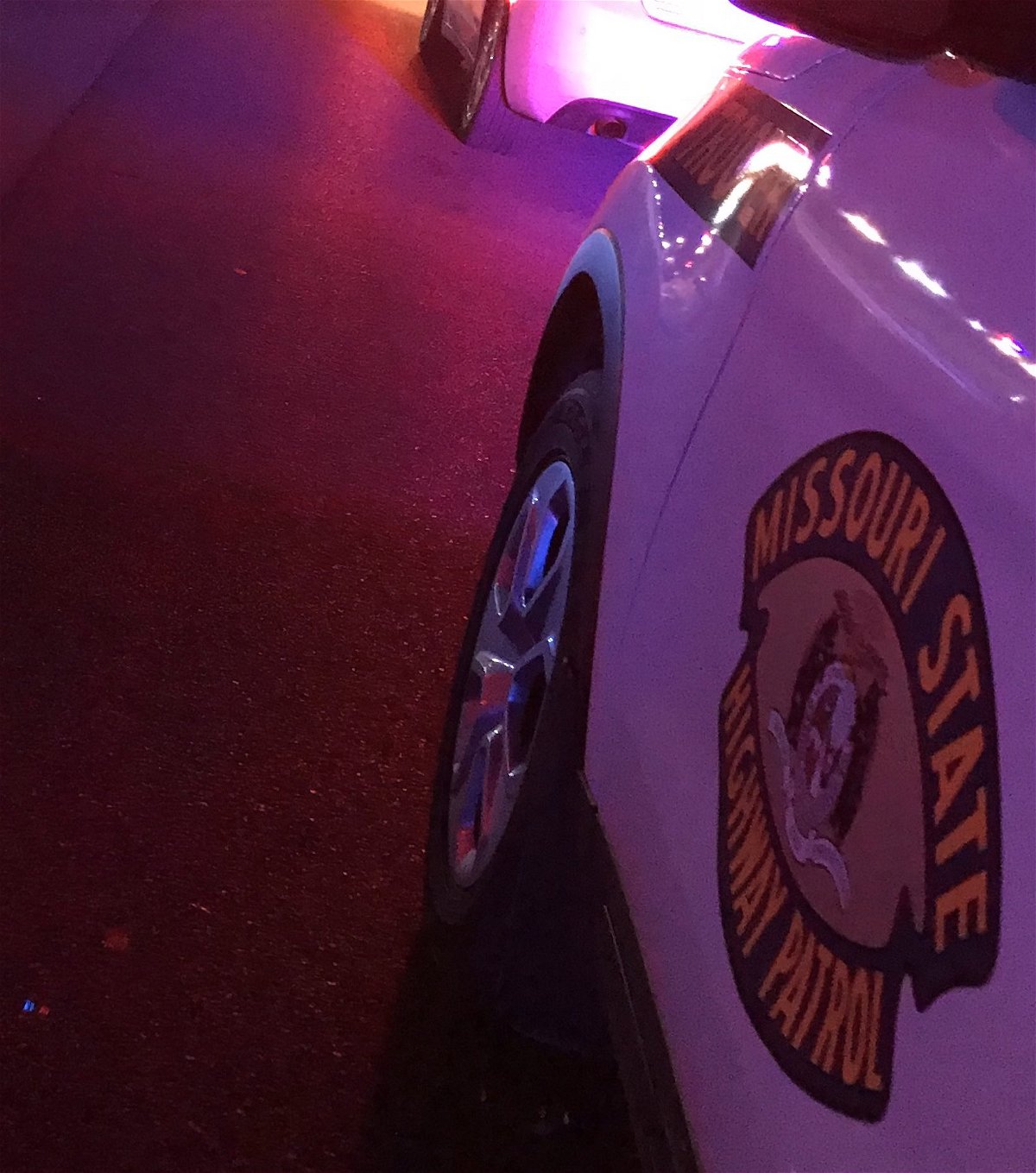 Missouri State Highway Patrol Vehicle parked with its lights on.