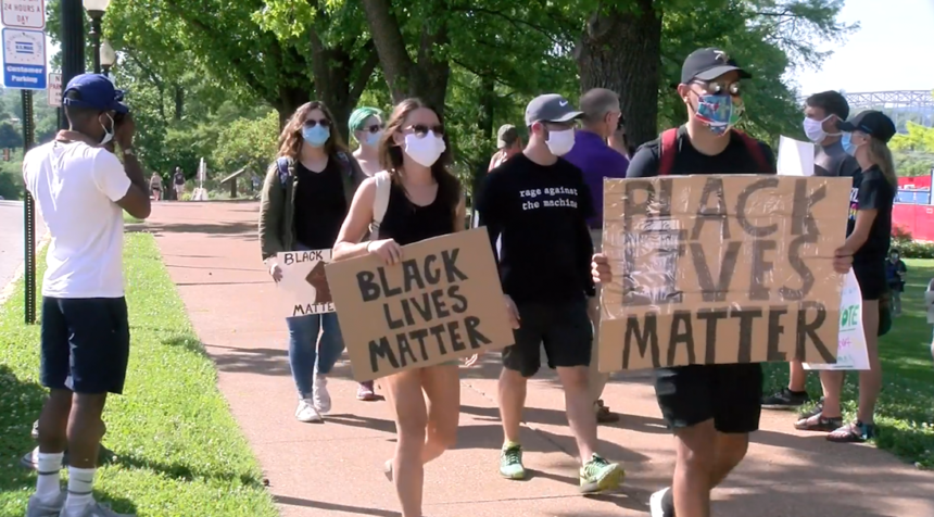 Demonstrators in Jefferson City wearing masks