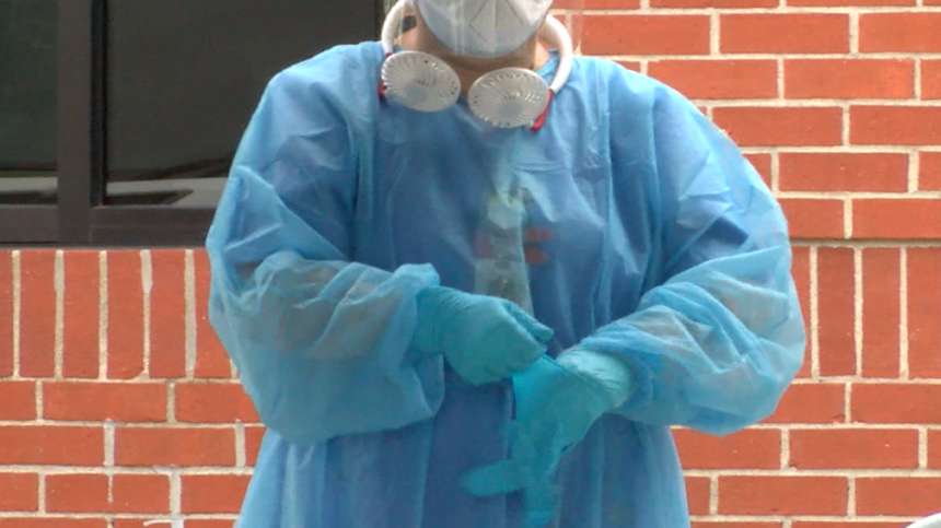 Columbia nurse administering COVID-19 tests