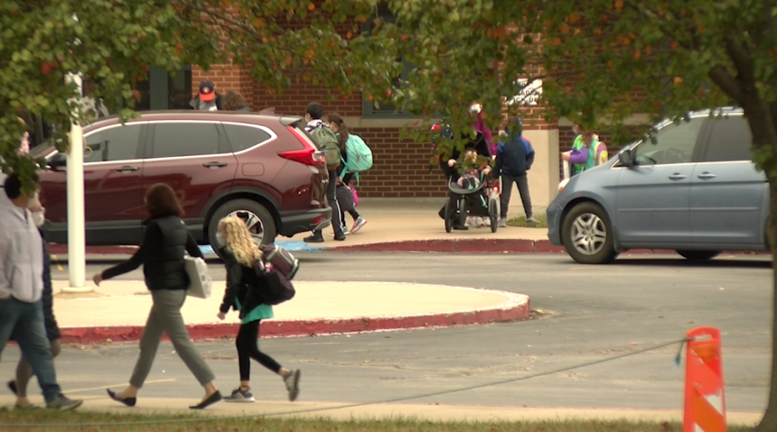 Parents drop off students as they return to in-person classes at Paxton Keeley Elementary.