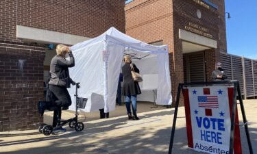 Voters in line to cast their absentee ballots Monday at the Boone County Government Center.