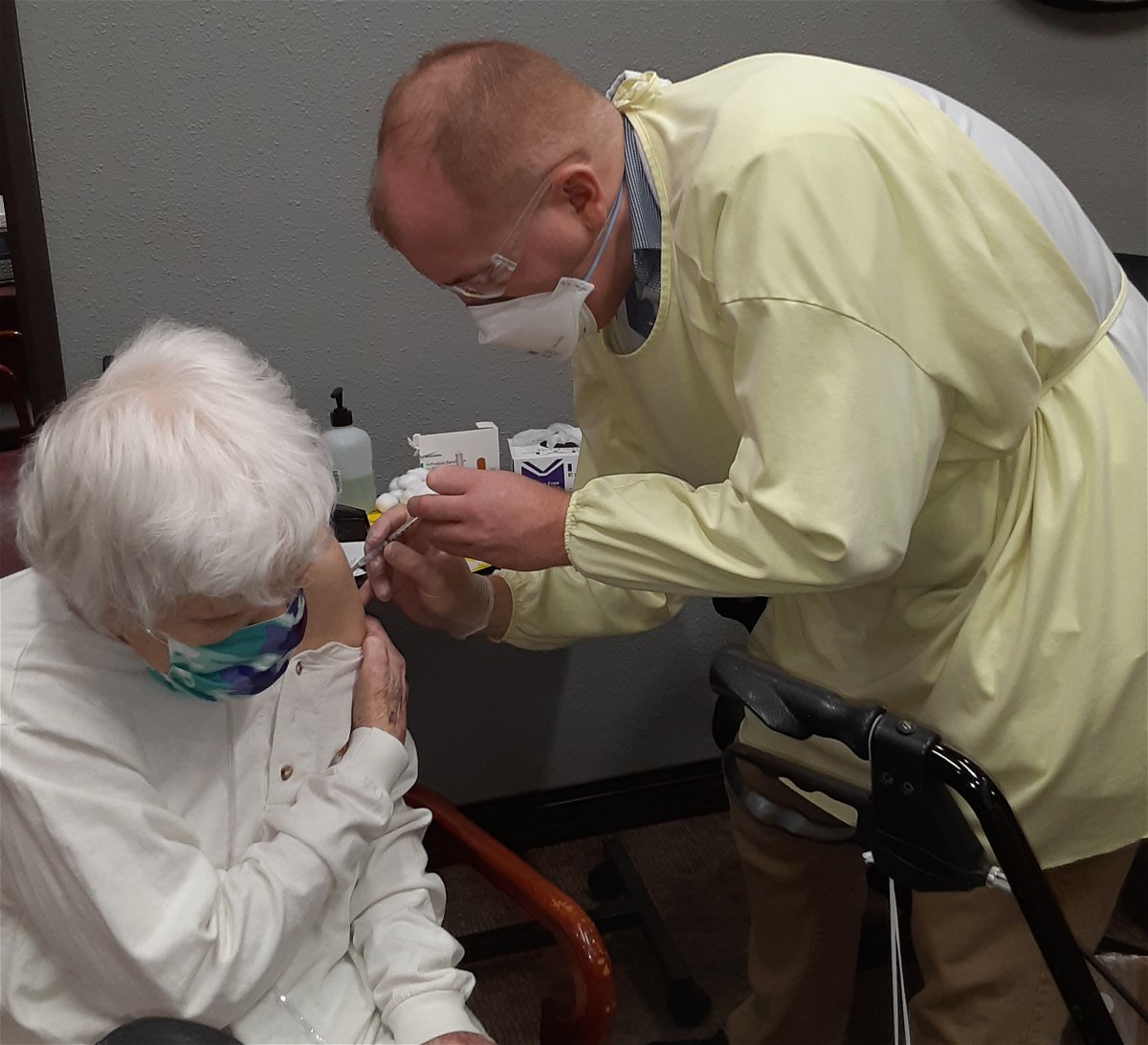A resident at Jefferson City Manor nursing home receives a coronavirus vaccine shot Wednesday, Dec. 30, 2020.