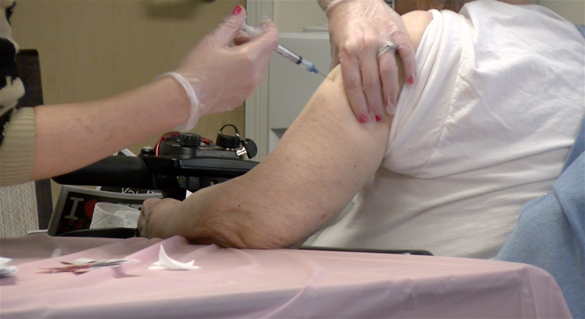 A Solstice Senior Living resident gets a coronavirus vaccine shot during a clinic Tuesday, Feb. 9, 2021. 