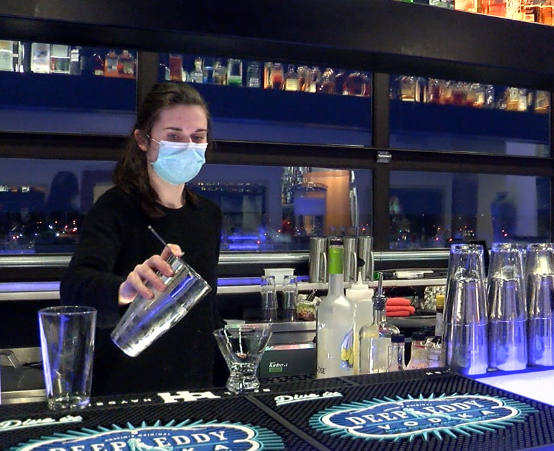A bartender at Pressed in Columbia pours a drink on Wednesday, Feb. 10, 2021.