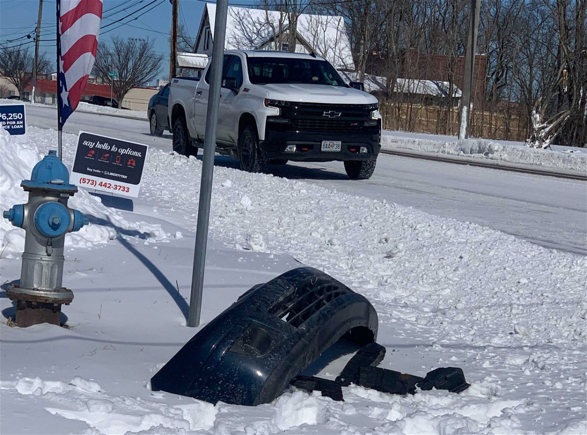 A vehicle's bumper lays in the snow after a crash at Providence Road and Worley Street in Columbia on Tuesday, Feb. 16, 2021. 
