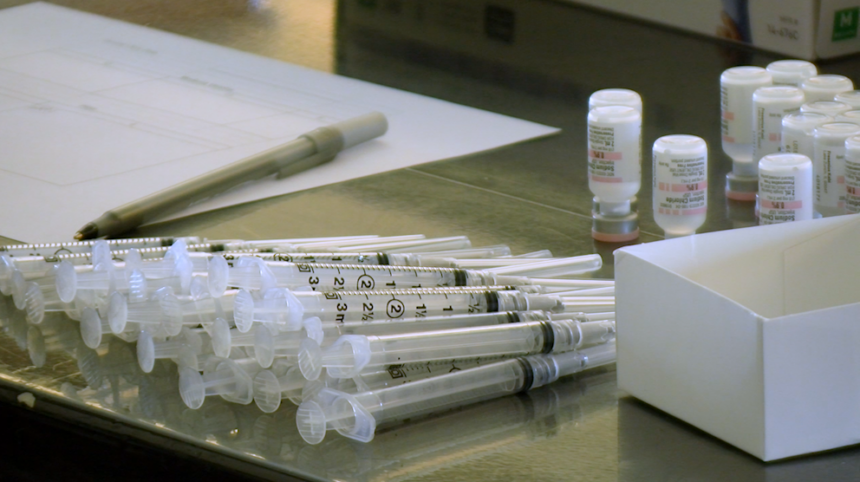 Coronavirus vaccine doses and syringes