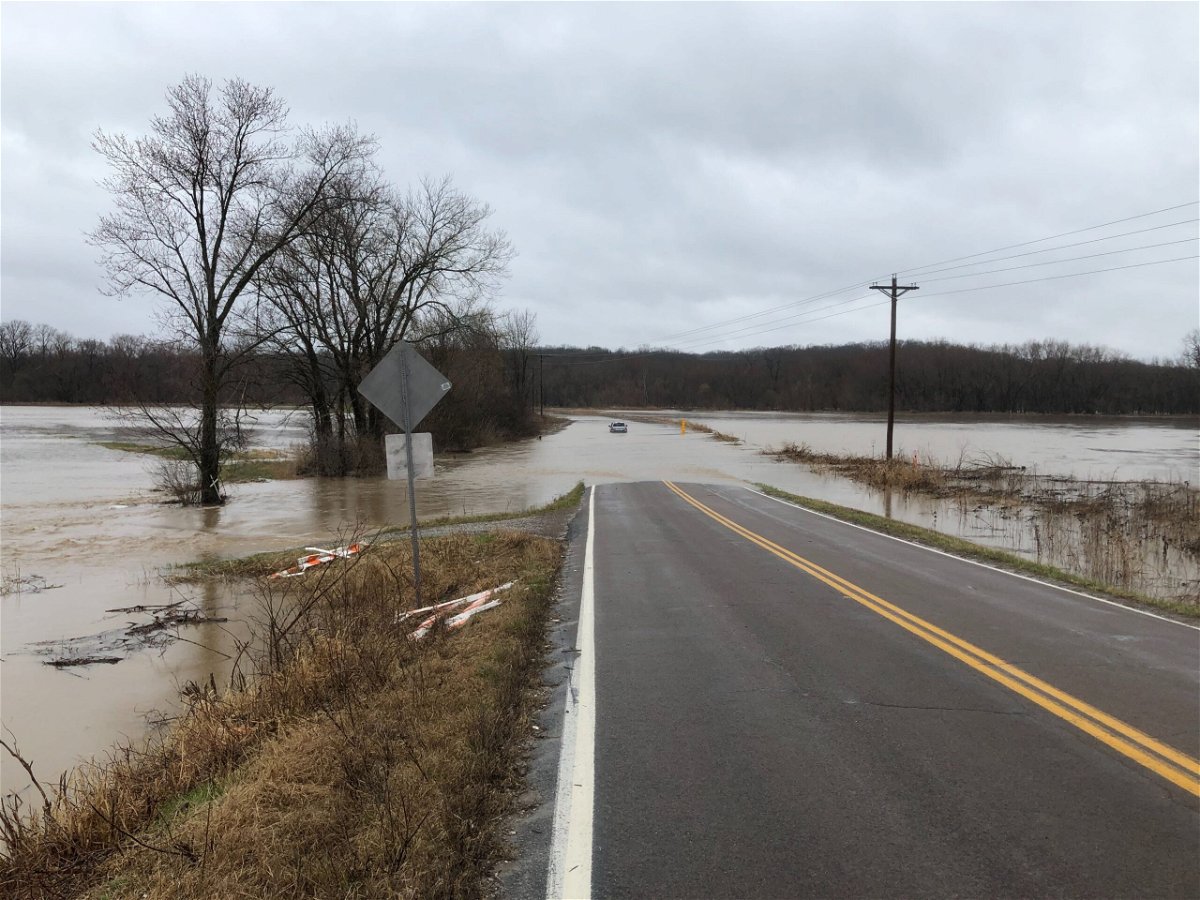 A vehicle sits in floodwater near Route E and Wilcox Road in Boone County on Thursday, March 18, 2021.
