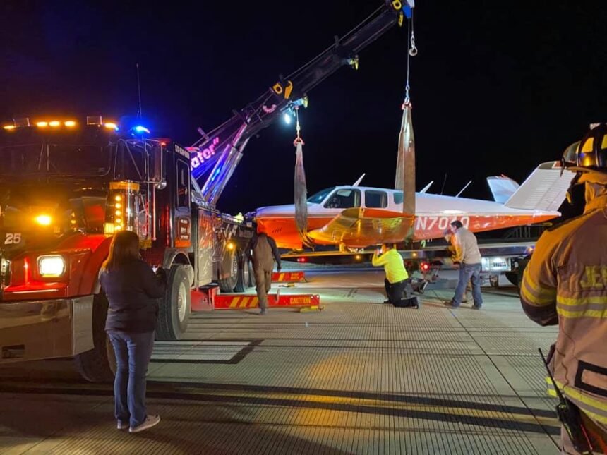 Plane loaded onto tow truck