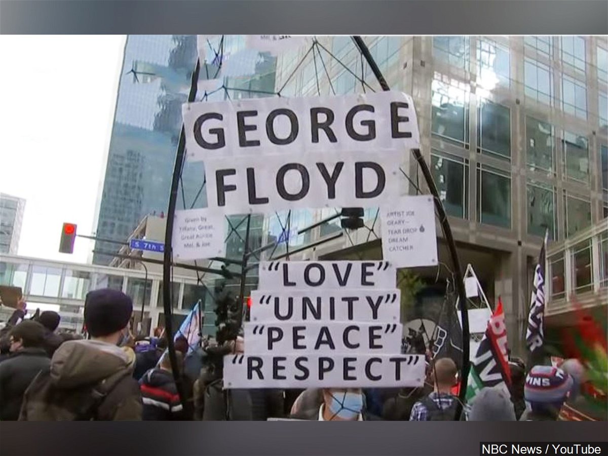 A sign in tribute to George Floyd outside the courthouse in Minneapolis on Tuesday, April 20, 2021.