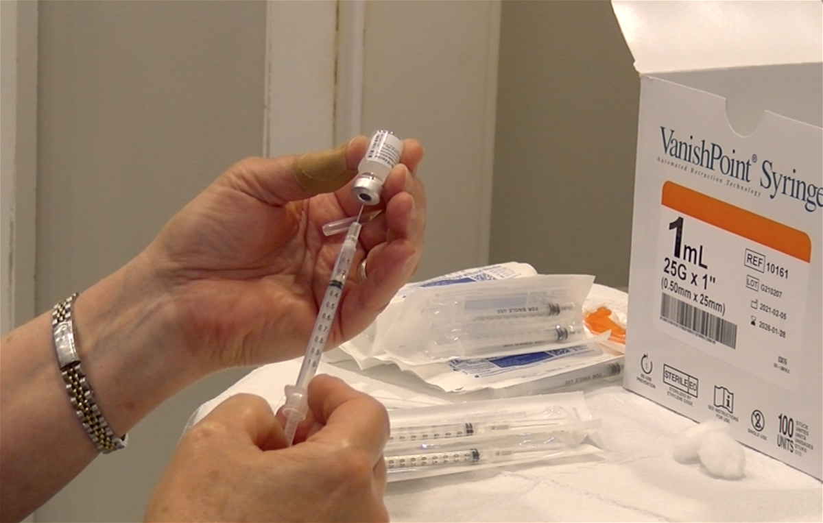 A syringe is filled with coronavirus vaccine during a clinic at the Columbia Mall on Monday, April 19, 2021.