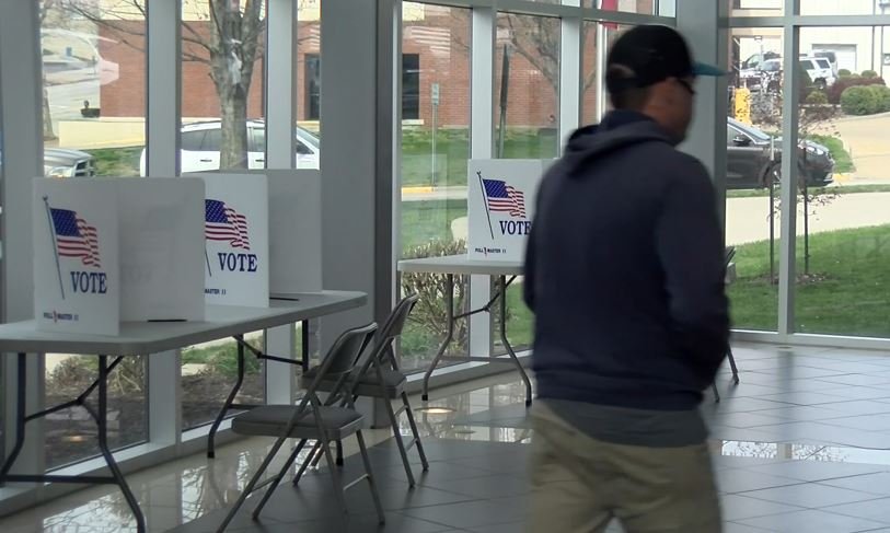 A voter walks past voting stations at the Miller Performing Arts Center in Jefferson City on Tuesday, April 6, 2021.