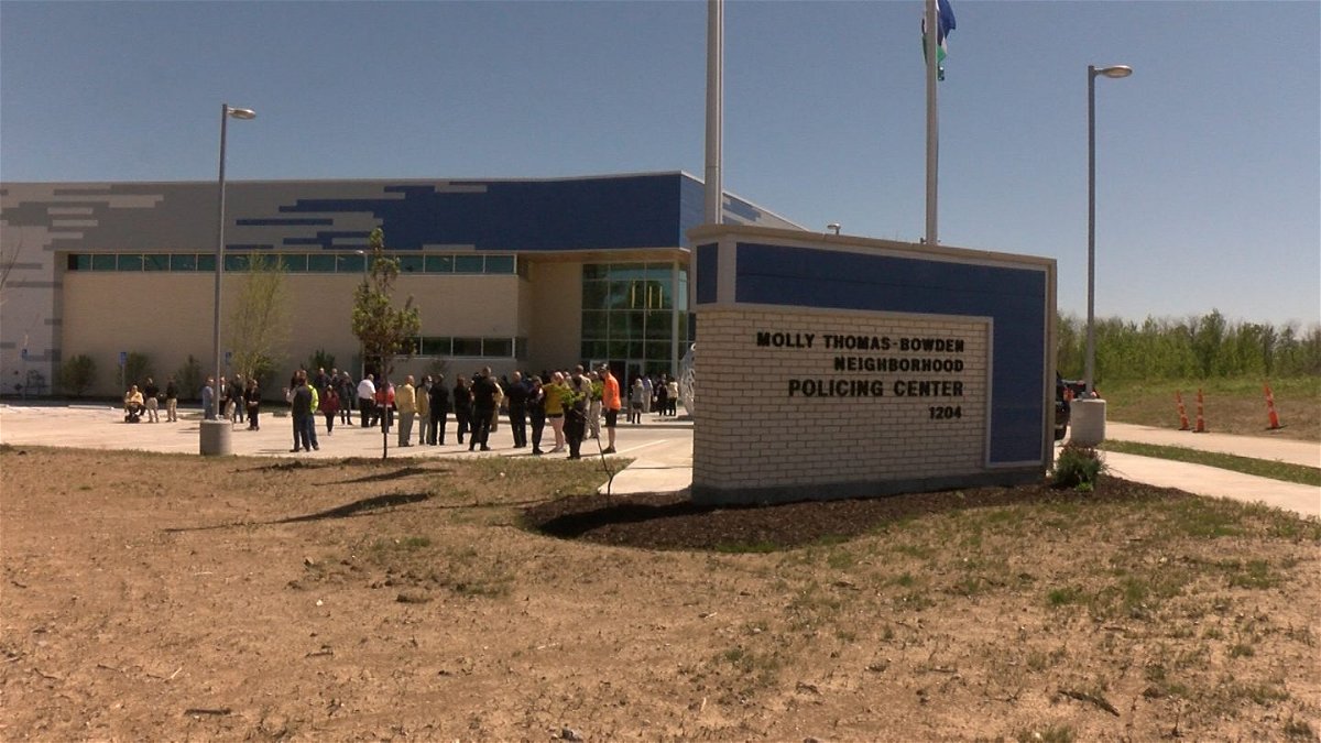 A crowd gathers for a ribbon cutting at the Molly Thomas-Bowden Neighborhood Policing Center on Wednesday, May 12, 2021.