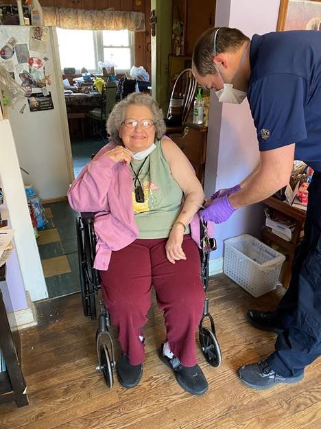 Central Jackson County Fire District, Captain Paramedic, Nathan Manley is providing vaccination to a homebound resident.
