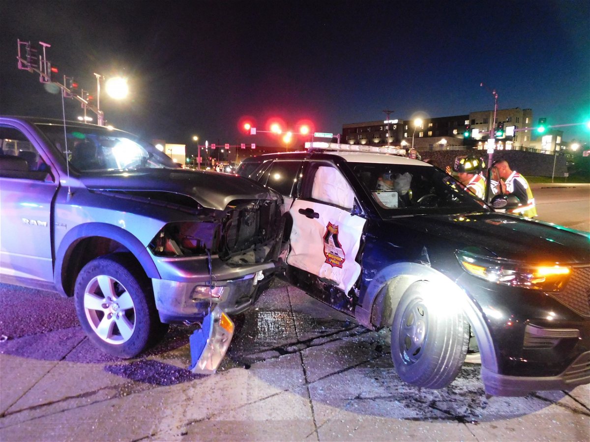 A damaged truck and Jefferson City police cruiser after a crash at Highway 50 and Missouri Boulevard on Tuesday, May 4, 2021.