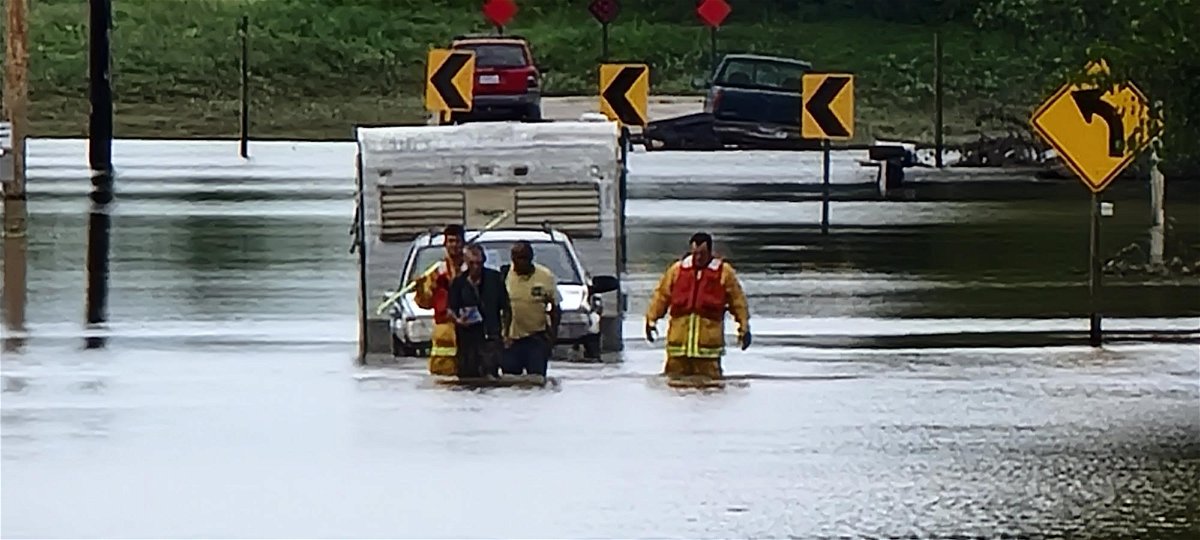 Firefighters rescue man from floodwater