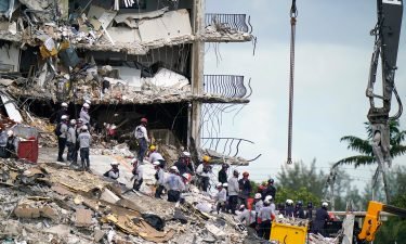 Rescue workers search in the rubble at the Champlain Towers South condominium on June 28 in the Surfside area of Miami.