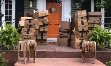 A New York woman is giving back to the community after more than 150 Amazon boxes that did not belong to her showed up at her house.