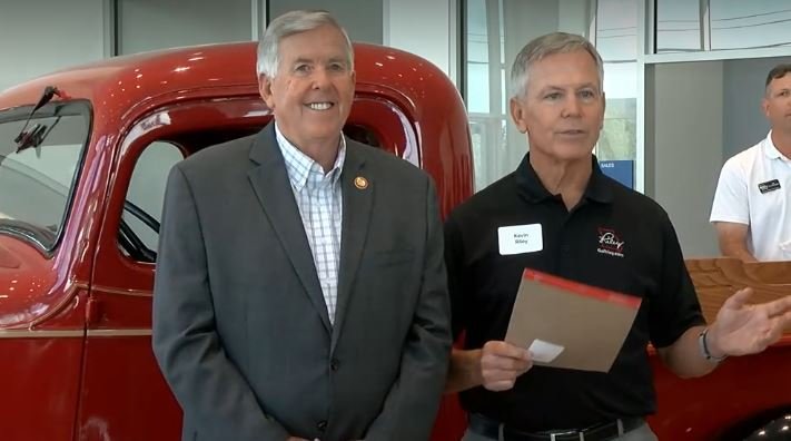 Gov. Mike Parson visited a Riley dealership in Jefferson City in June to celebrate its rebuilding after a tornado.