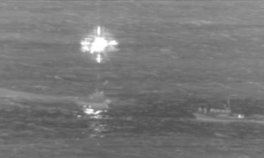 The US Coast Guard says the two cargo plane crew members were in stable condition when they were rescued by a USCG MH-65 Dolphin helicopter and a Honolulu Fire Department rescue boa