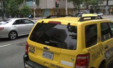 Taxi drivers say they are enjoying a surge in business as surge pricing on Lyft and Uber drives customers to look elsewhere for a ride.