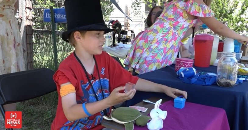 <i>EAST IDAHO NEWS</i><br/>Alexander Wilcox stands at his roadside magic booth and lemonade stand in Menan