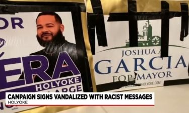 Campaign signs for Israel Rivera (left) and Joshua Garcia were vandalized with a racist message.