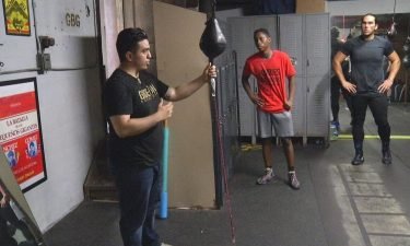 Joe Medez (left) uses his gym to provide boxing instruction but aslo keep youth off the street.