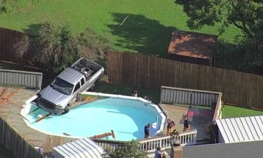 A person is in custody after crashing a stolen vehicle into a pool in Yukon