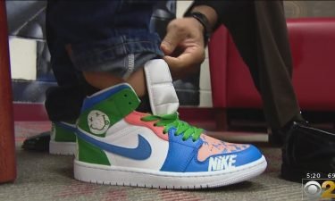 A Chicago teacher found a way to reward his students with new sneakers that he hand painted after they designed them.