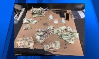 Portland police say a large amount of drugs and money were seized while officers were conducting a welfare check on a vehicle on Tuesday.