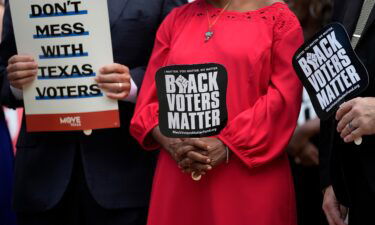 Democratic caucus members of the Texas House join a rally on the steps of the Texas Capitol to support voting rights on July 8