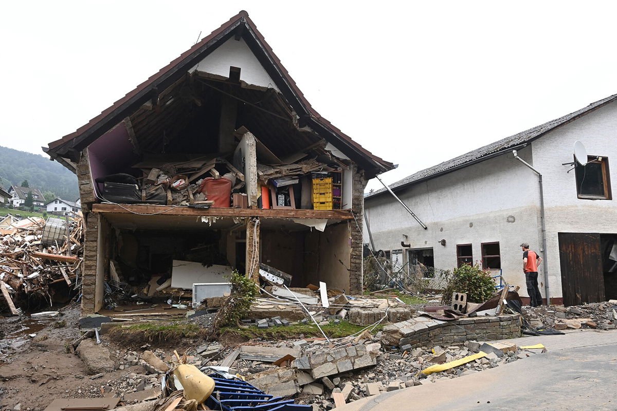 <i>Christof Stache/AFP/Getty Images</i><br/>A man stands in front of a destroyed house after floods caused major damage in Schuld near Bad Neuenahr-Ahrweiler