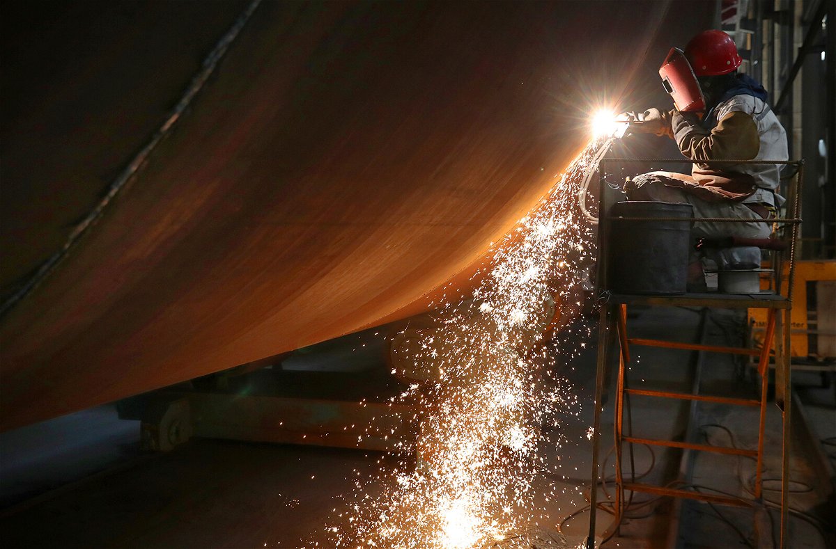 <i>Xu Congjun/FeatureChina/Getty Images</i><br/>A welder works at a factory of wind farm facilities in Rudong county in east China's Jiangsu province on June 7. China is releasing its latest quarterly economic growth figures on July 15