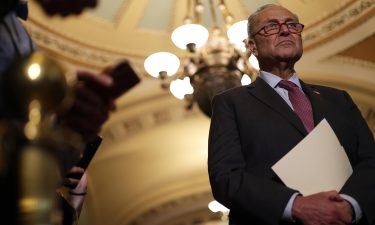 Sen. Chuck Schumer listens during a news briefing at the U.S. Capitol July 13 in Washington