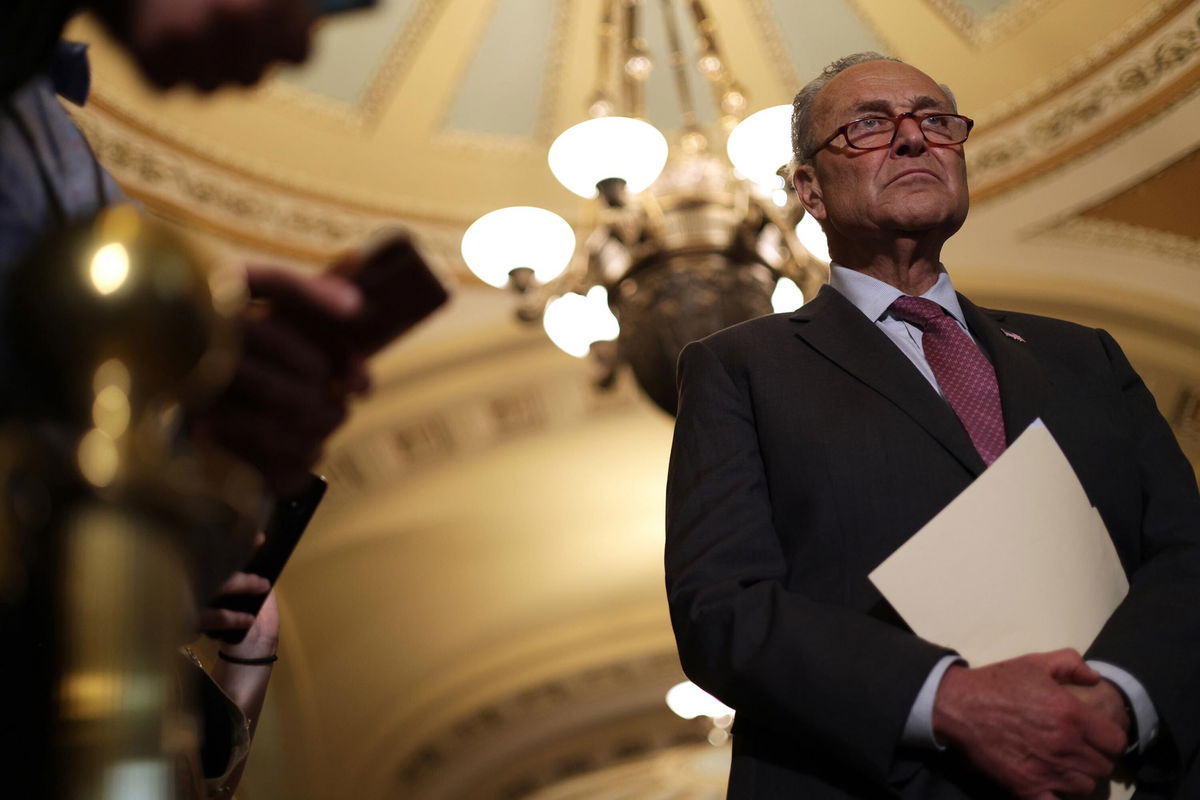 <i>Alex Wong/Getty Images</i><br/>Sen. Chuck Schumer listens during a news briefing at the U.S. Capitol July 13 in Washington