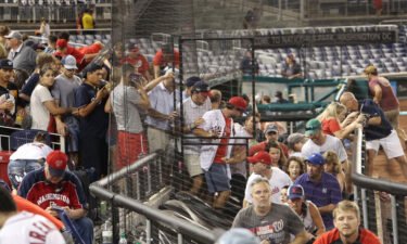 Fans leave their seats as a shooting took place outside Nationals Park during an MLB game in Washington