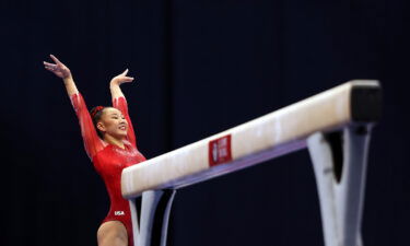 Kara Eaker smiles after her balance beam dismount during the US Gymnastics Olympic Trials in June. What could have been the pinnacle of her acclaimed career has been thwarted by positive coronavirus tests.