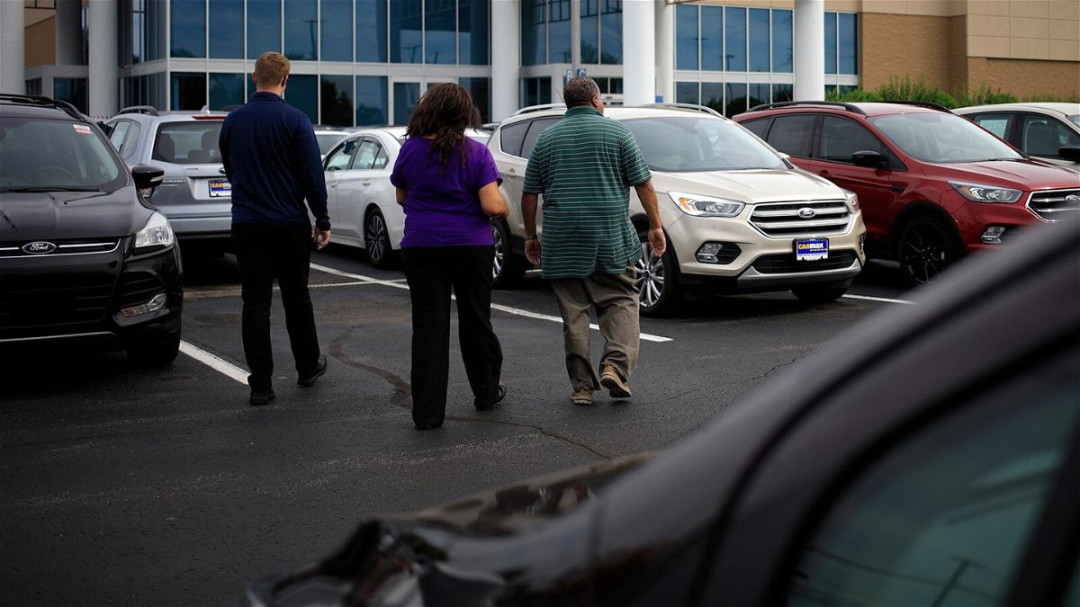 <i>Luke Sharrett/Bloomberg/Getty Images</i><br/>Customers shop for used vehicles at a CarMax dealership in Louisville