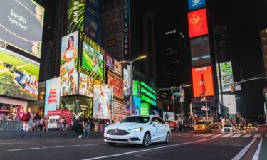 A self-driving vehicle from Mobileye's autonomous test fleet navigates New York City's Times Square in June 2021.
