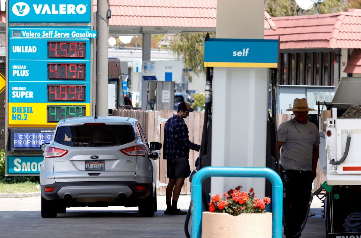 <i>Justin Sullivan/Getty Images</i><br/>A customer prepares to pump gasoline into his car at a Valero station on July 12 in Mill Valley