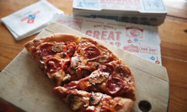 Domino's said its pizza delivery times are increasing a bit in some areas because of staffing shortages.