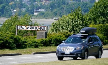 A car heads into the US from Canada at the Peace Arch border crossing on June 8