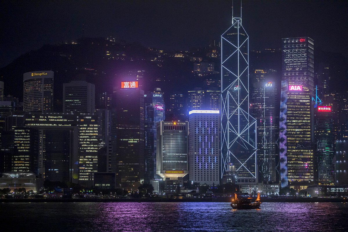 <i>Paul Yeung/Bloomberg/Getty Images</i><br/>A boat sails on along Victoria Harbor past the People's Liberation Army (PLA) Hong Kong Garrison building