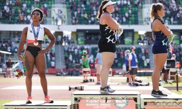 Gwendolyn Berry (left) stands on the podium having placed third in the hammer throw final at the US Olympic trials.